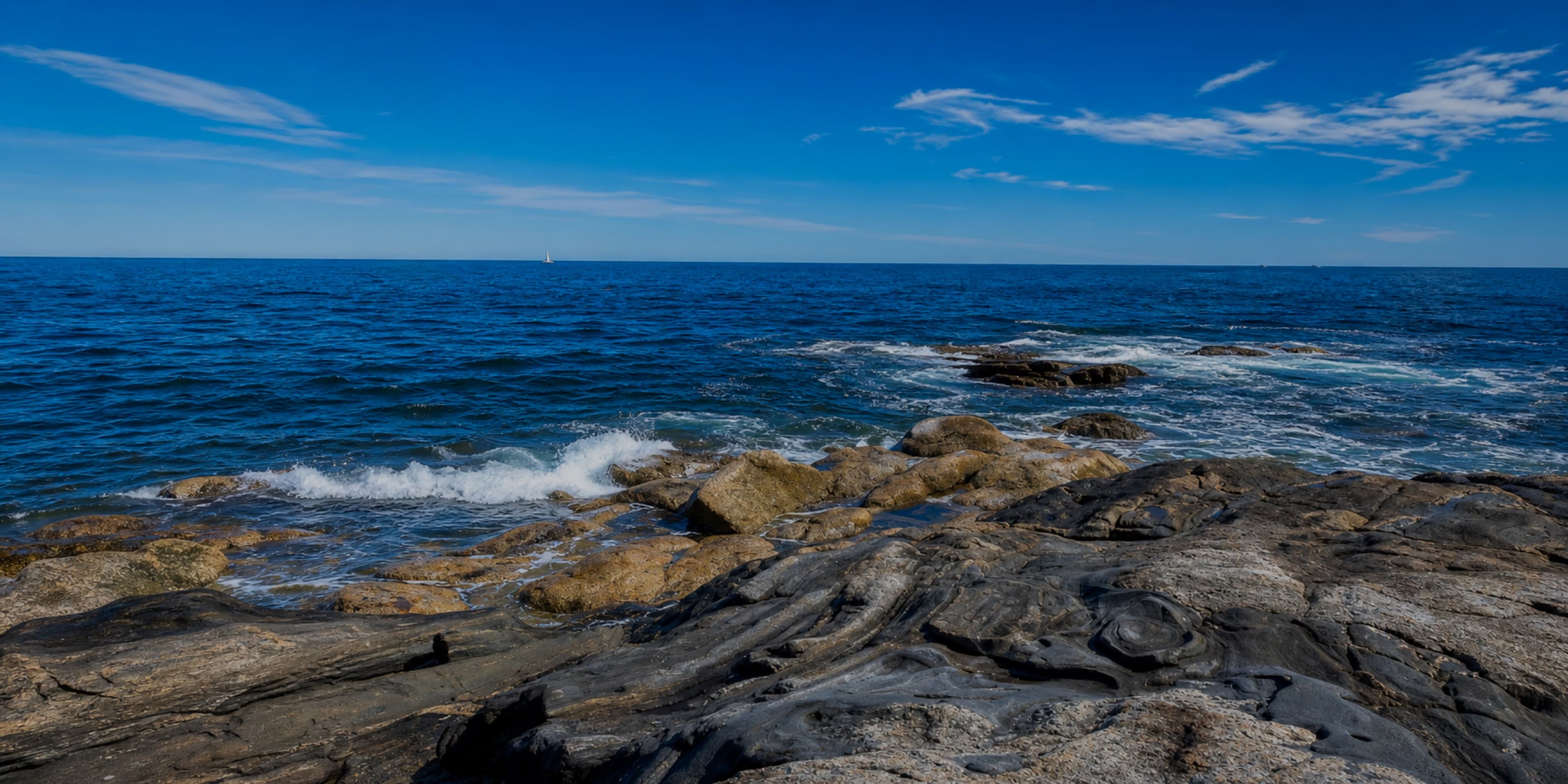 Waves breaking over the rocky Maine coast